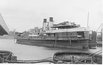 Curl Curl (hulked, front) and Dee Why at Strides shipbreakers, 1969. Once the largest and fastest ferries on the harbour, Curl Curl is scuttled at sea later that year, and Dee Why is scuttled in 1976